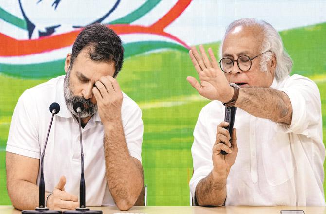 Jairam Ramesh addressing the media with Rahul Gandhi in Delhi. (PTI)